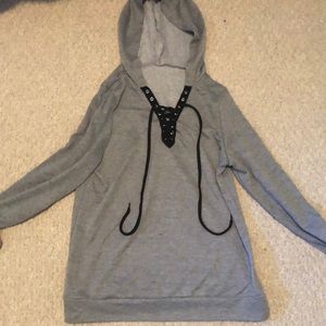 Grey sweatshirt with crisscross strings in front
